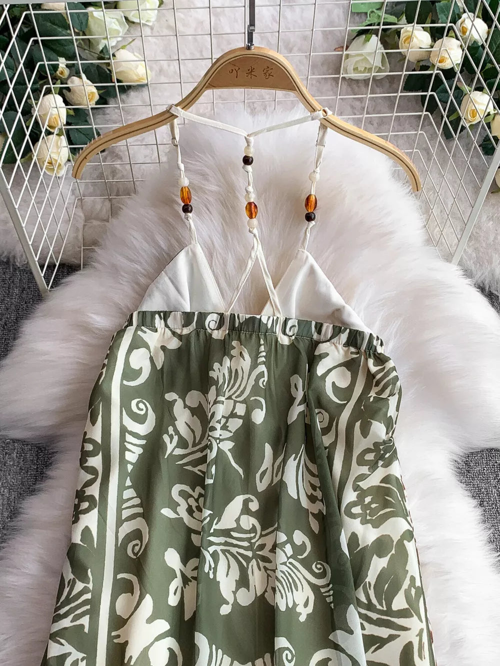 Dual-pattern V-neck cami dress with beaded straps and a green floral print.