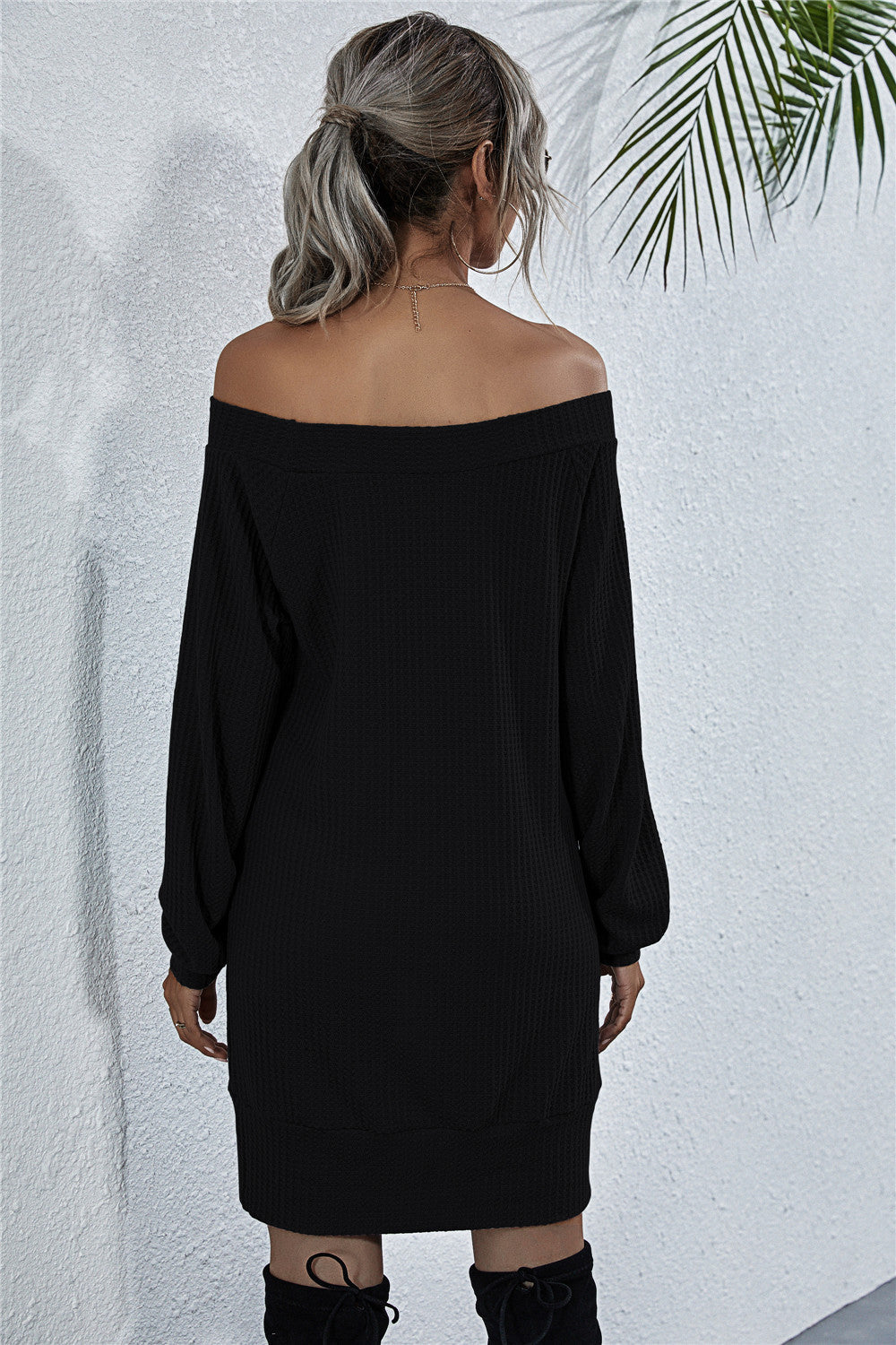 Black waffle knit off-shoulder mini dress with long sleeves