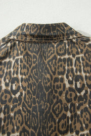 Denim dress with leopard print and puff sleeves, featuring a collar detail.