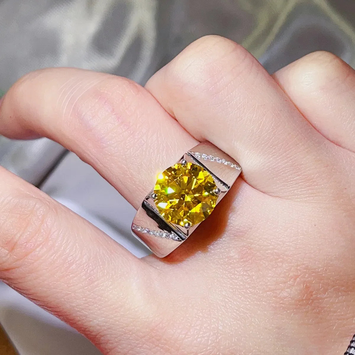 Radiant yellow moissanite ring in sterling silver with diamond accents