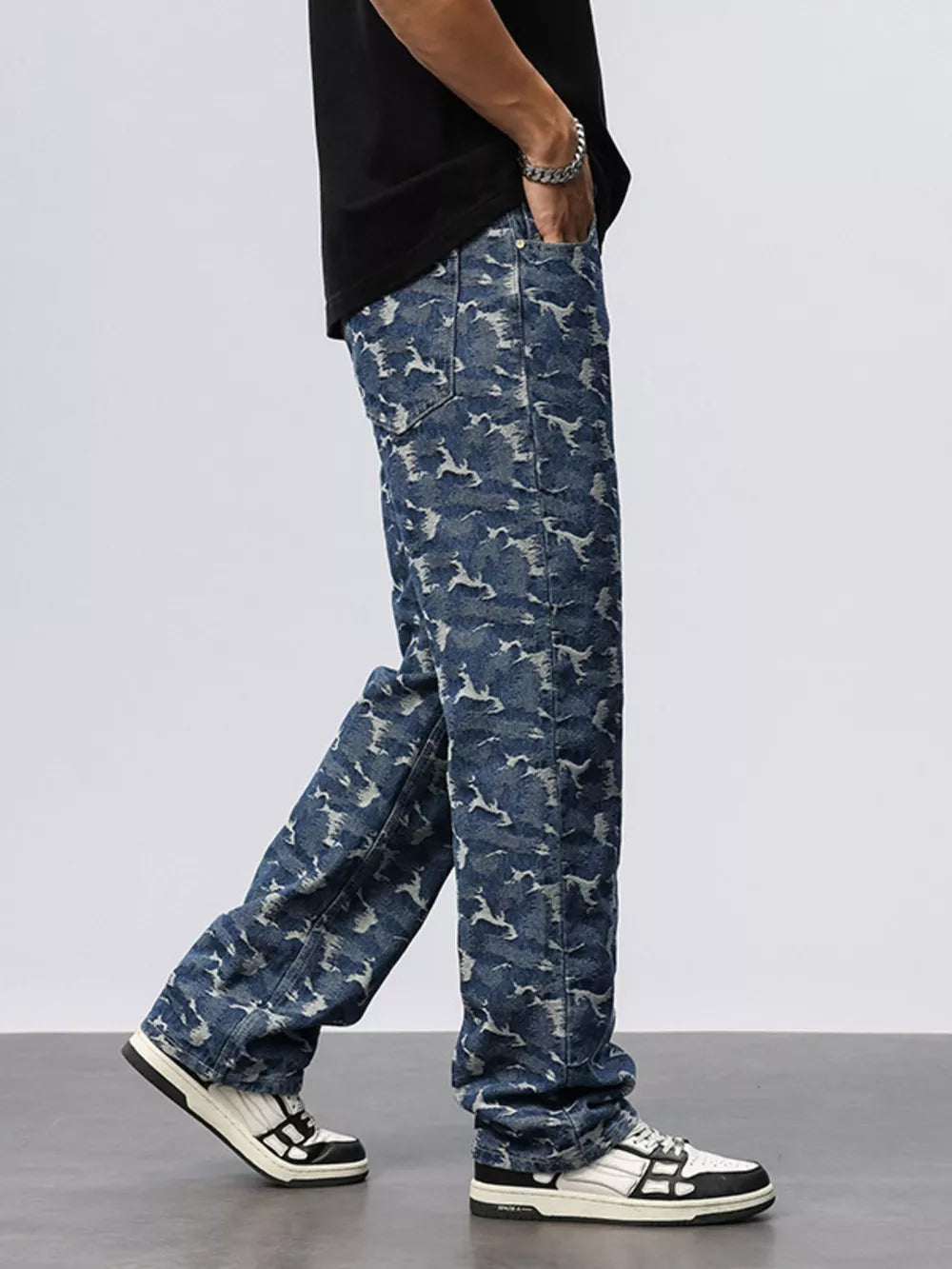 Relaxed fit blue cotton jeans with abstract camouflage pattern