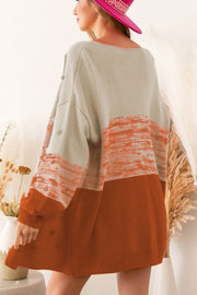 Textured acrylic colorblock cardigan in rust and cream with bobble details.