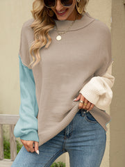 Colorblock drop shoulder knit sweater with tan, light blue, and cream panels.