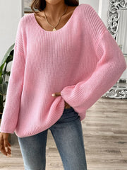 Dusty pink ribbed knit pullover sweater with off-the-shoulder neckline and long sleeves.
