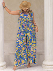 Blue floral tie-shoulder wide-leg jumpsuit with drawstring waist and V-neck.
