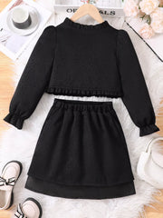 Black ruffle trim top and skirt set with long sleeves and elastic waist.
