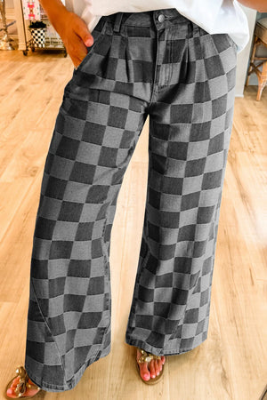 Checkerboard denim wide leg trousers in dark gray with a high waist and pleated front.