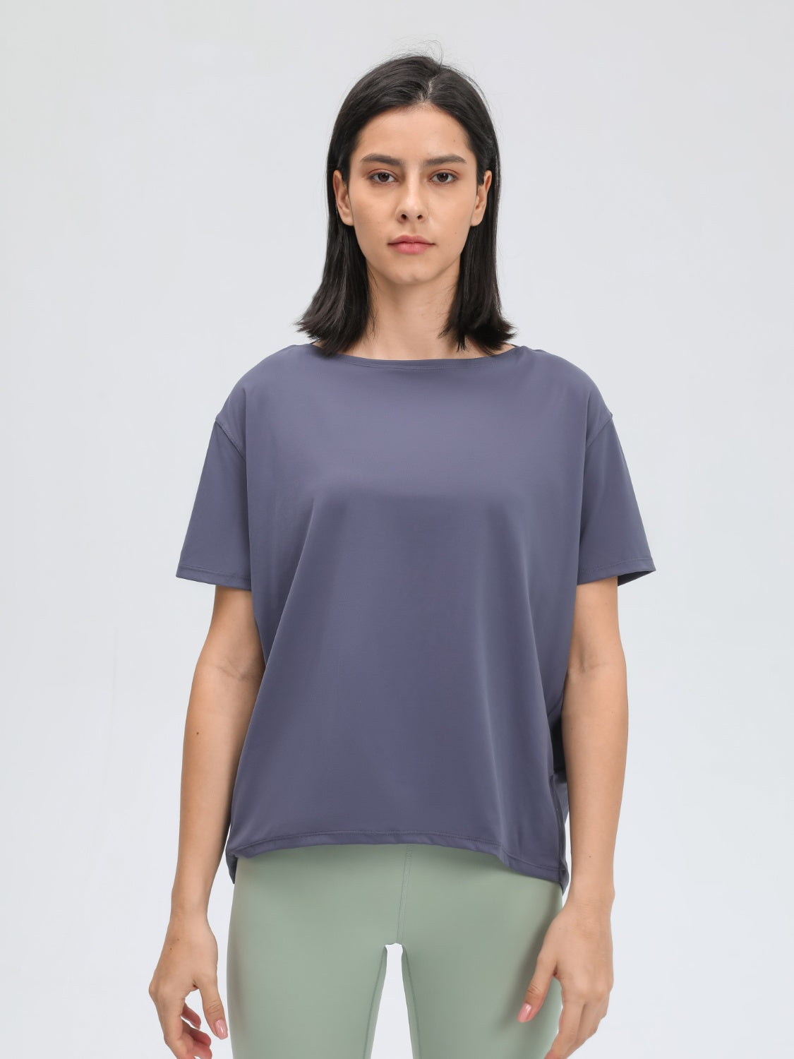 Relaxed fit performance tee in Dusty Blue with short sleeves and a boat neck.