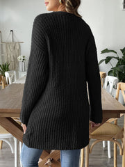 Black textured bouclé open-front cardigan with long sleeves and a relaxed fit.