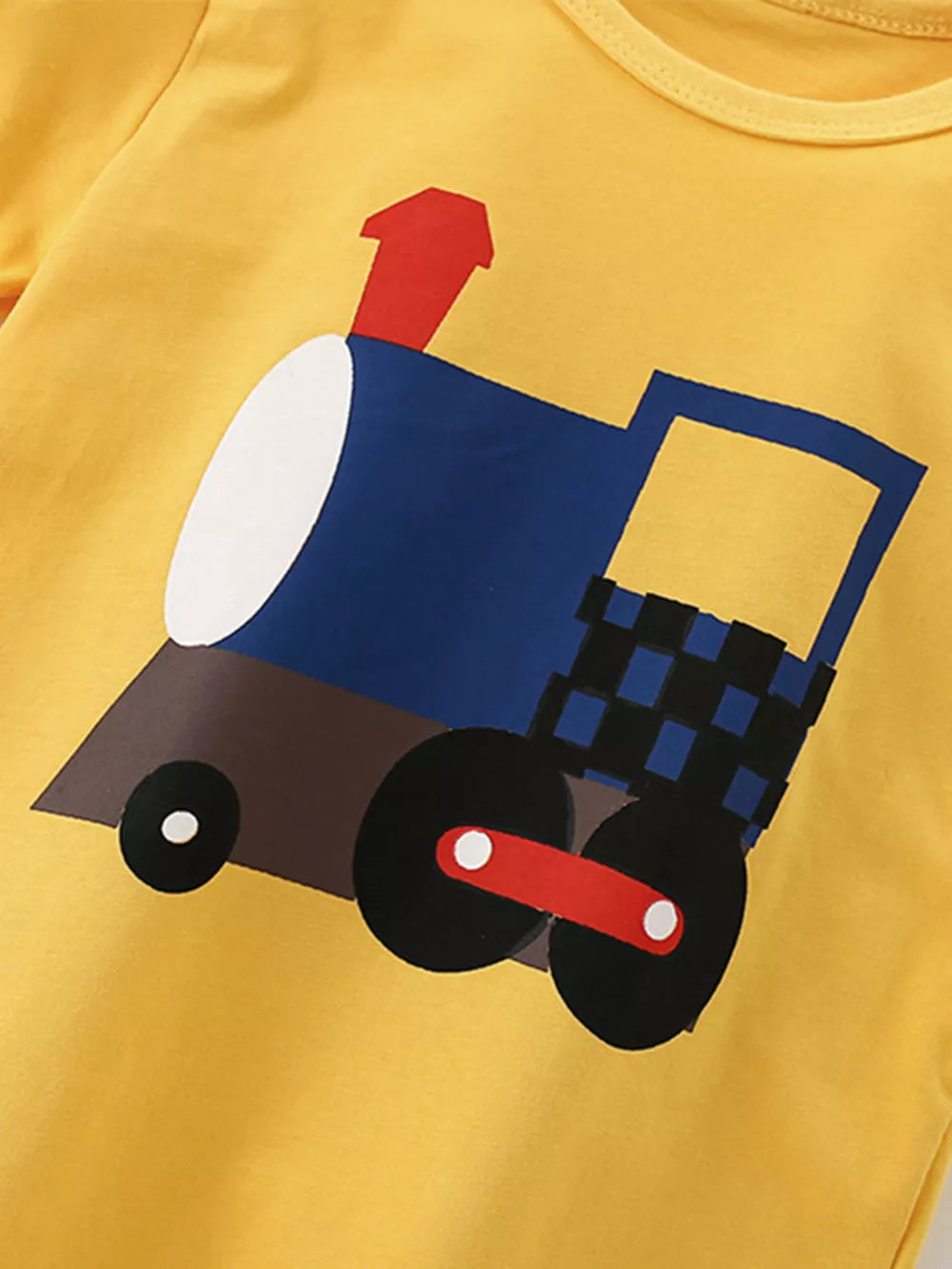 Yellow cotton t-shirt with a playful cartoon train graphic for kids.