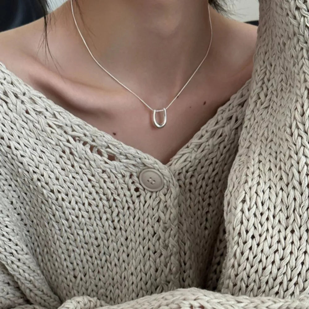 Sterling silver U-shaped pendant necklace on a delicate chain