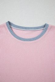 Ribbed blush pink loungewear top with a contrasting grey crewneck collar.