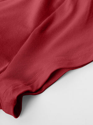 Burgundy built-in bralette tee showing fabric texture and double-stitched hem detail.
