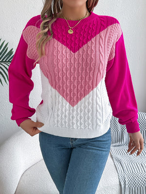 Chevron cable knit sweater with contrast hot pink, light pink, and white panels.