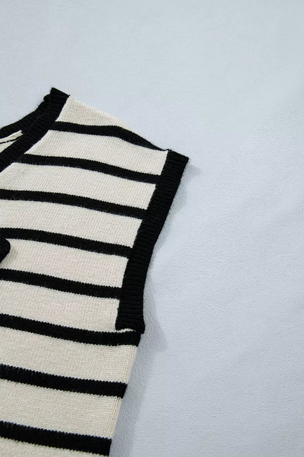 Chic black and cream striped knit vest with bow detail
