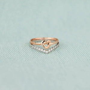 Knot & Chevron Zircon Ring Stack in silver with rose gold heart detail.