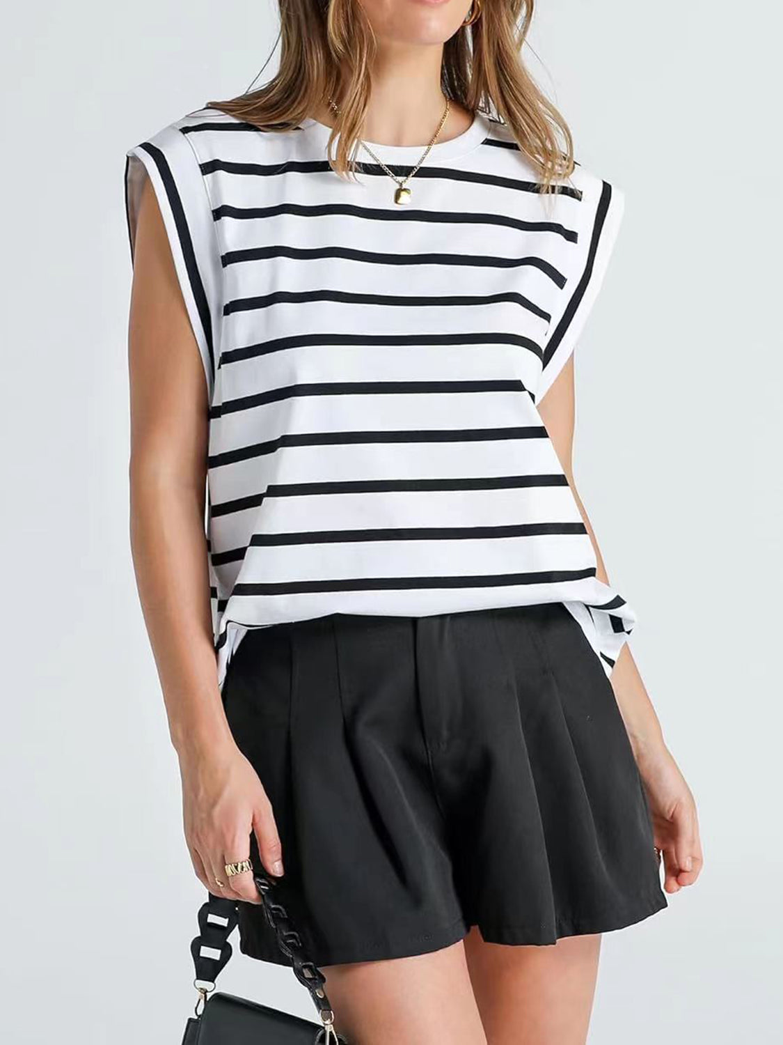 Padded shoulder tank top with black and white Breton stripes and a crew neck.