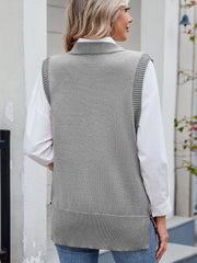 Gray ribbed knit vest with side buttons and collar detail, styled over a white shirt.