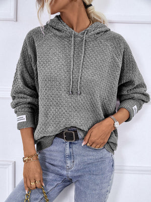 Charcoal textured knit raglan sleeve hoodie with drawstring hood and cuff detail.