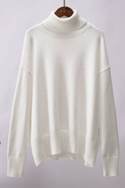 White relaxed roll-neck sweater with a boxy knit and ribbed details.