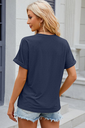 Dark Blue textured henley tee with rolled sleeves and a buttoned neckline.