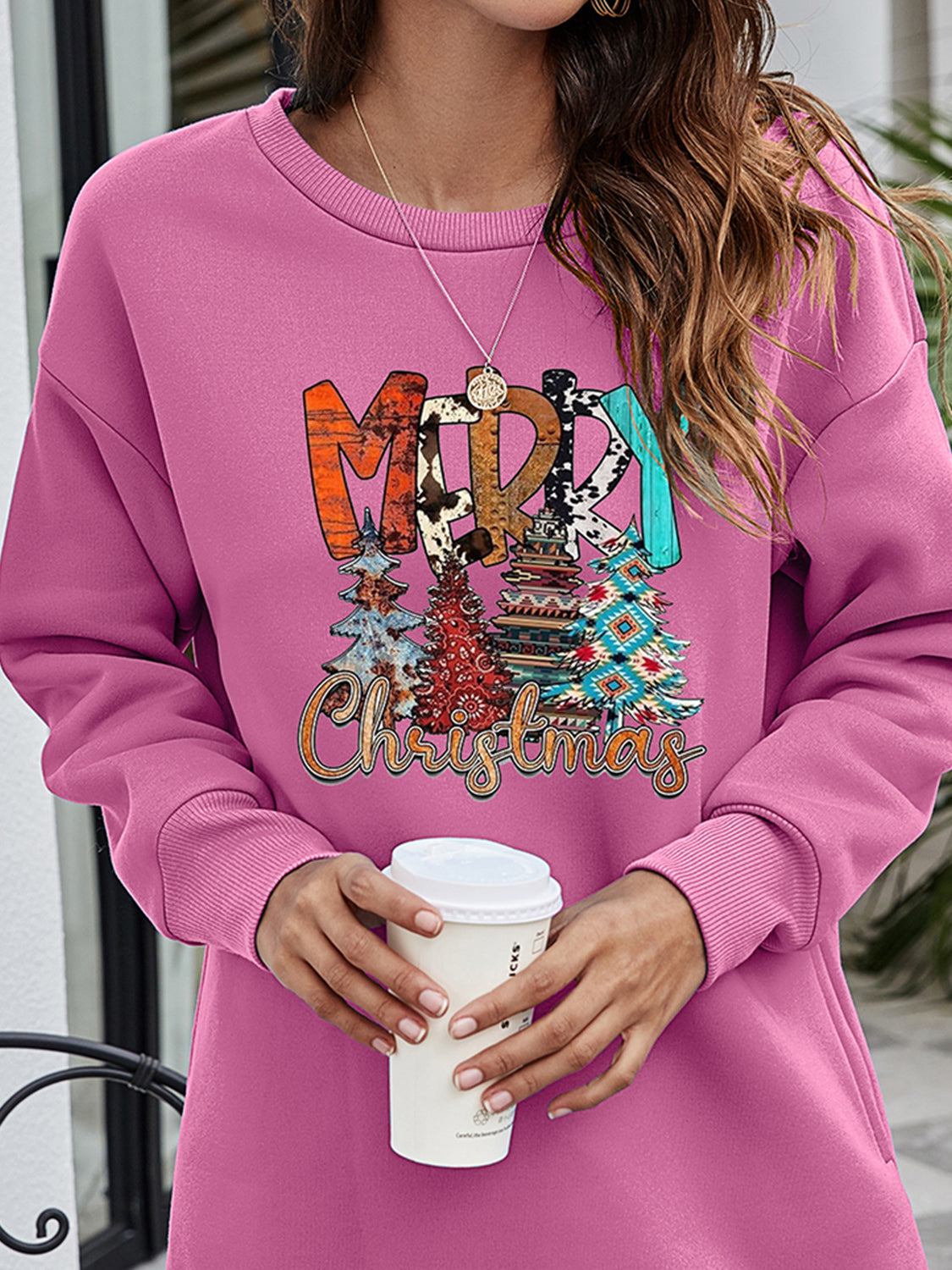 Dusty Purple extended hemline sweatshirt with Merry Christmas graphic and festive trees.