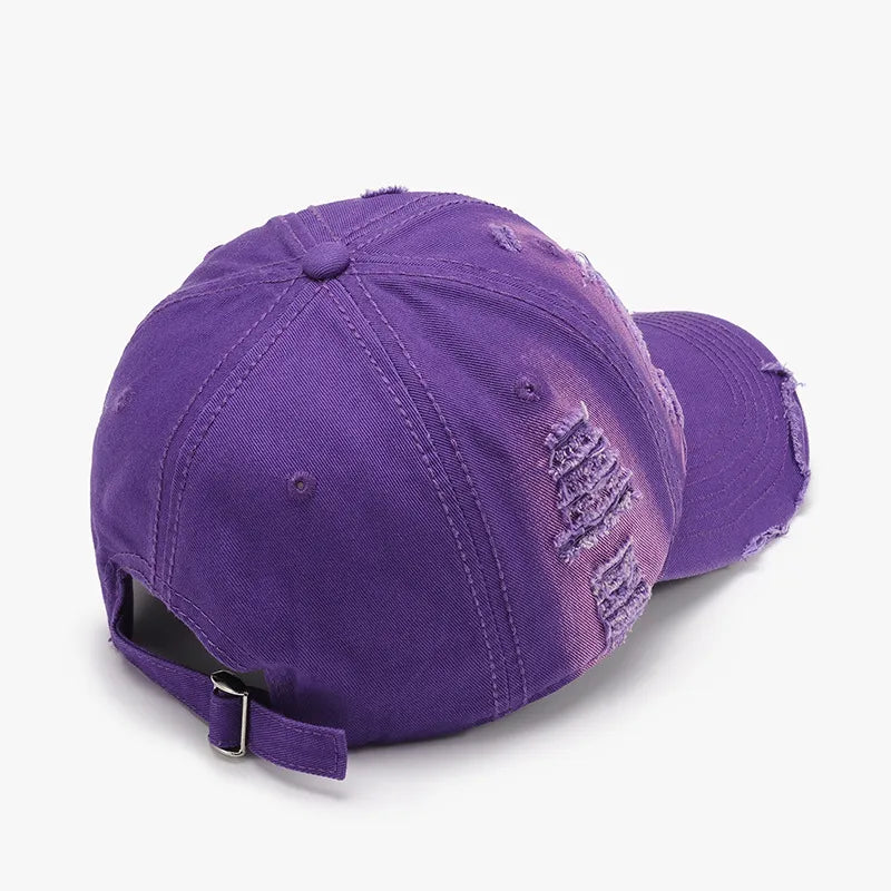 Purple distressed canvas baseball cap with frayed details and adjustable strap.