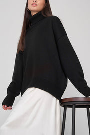 Black relaxed roll-neck sweater with boxy fit and ribbed cuffs and hem