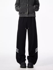 Black sweatpants with drawstring and white stripe detail on leg
