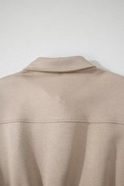 Chic collared zip front pocketed romper in beige.