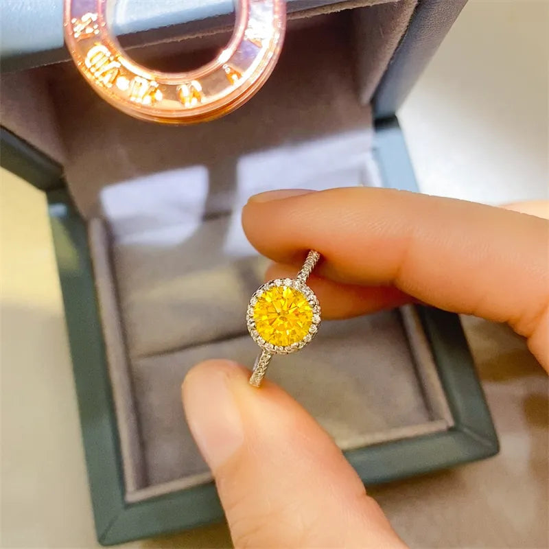 Halo-set canary diamond ring in silver with a diamond band.