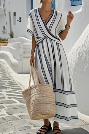 Maternity wrap maxi dress with navy and white stripes, V-neck, and short sleeves.