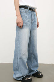 Baggy light blue denim palazzo jeans with a faded wash and wide leg.