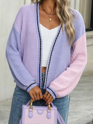 Colorblock trim knit cardigan in pink purple and light pink acrylic with black stripe detail.
