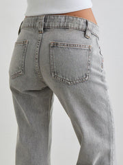 Light gray cotton low rise flare leg jeans with back pockets.