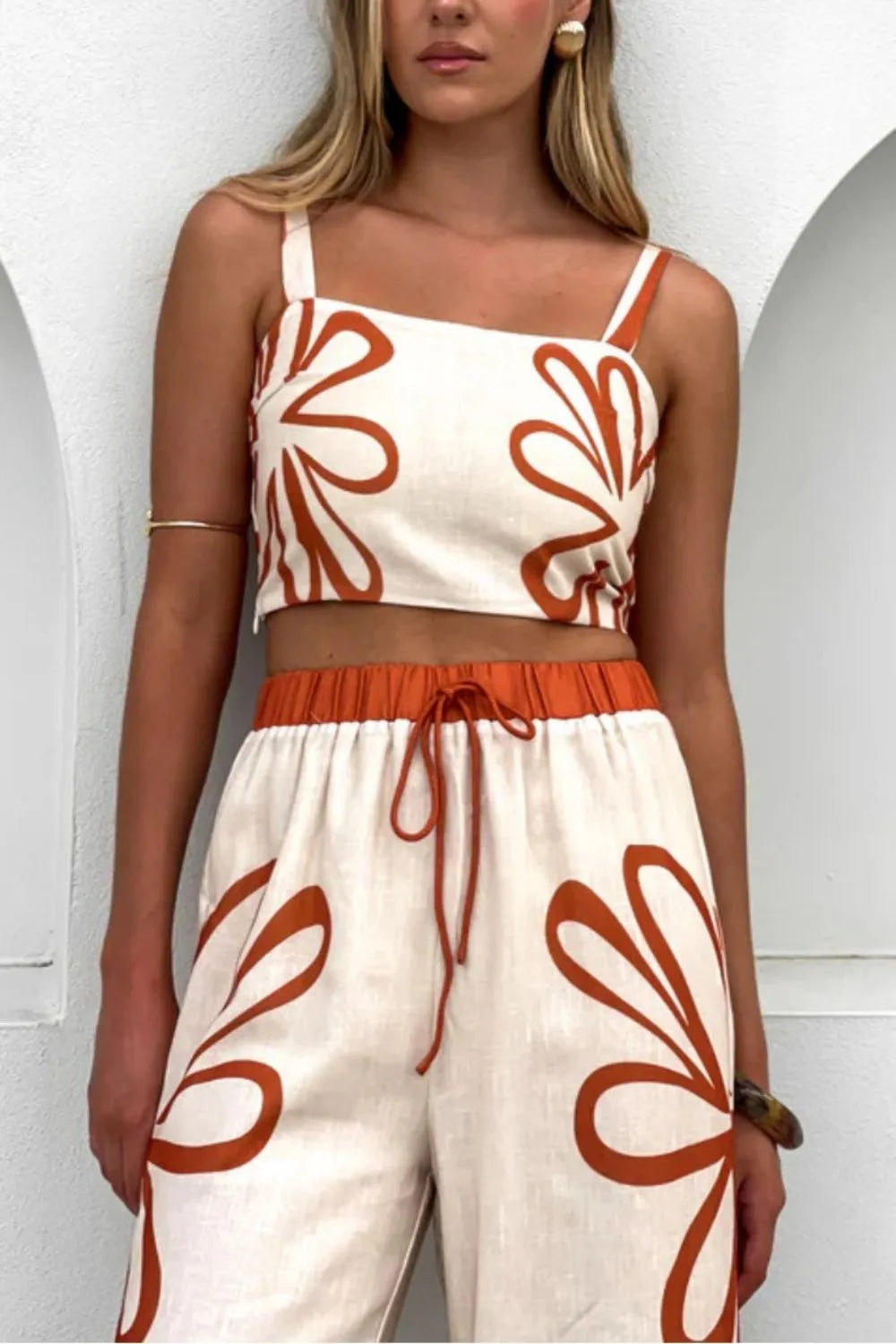 Floral print linen co-ord set with square neck crop top and drawstring waist pants in ochre.