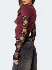 Wine red fitted t-shirt with black lace sleeves and crew neck.