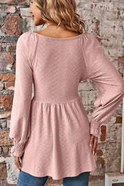 Blush pink textured blouse with shirred sleeves and empire waist