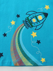 Blue cotton t-shirt with a playful rocket graphic and rainbow trail, surrounded by stars.