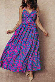 Maxi dress with blue and pink floral print, V-neck, cutout detail, and backless design.