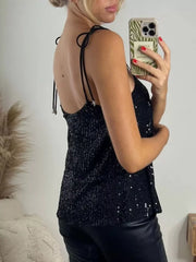 Black sequin cami top with tie shoulders and star detail.