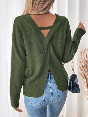 Army green acrylic knit sweater with twisted V-back detail and cut-out strap.