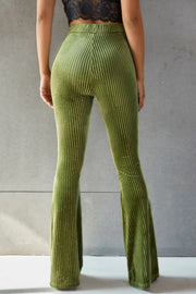 Ribbed velvet palazzo trousers in matcha green with a flared leg.