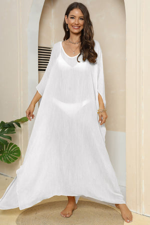 White oversized caftan cover-up with side slits and a relaxed fit.