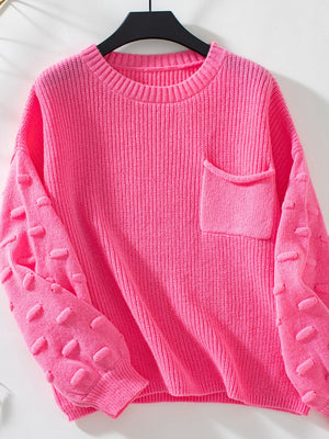 Hot Pink knit sweater with textured sleeve details and a chest pocket.