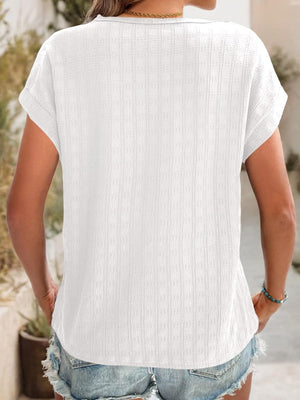 White woven texture cap-sleeve blouse with a relaxed fit and casual styling.