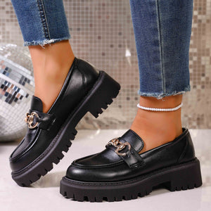 Chunky lug sole loafers in gloss black with gold chain detail and thick platform sole.