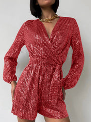 Scarlet sequin wrap romper with blouson sleeves and a tie waist.