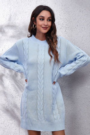 Light blue cable knit sweater dress with crewneck and long sleeves.