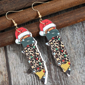 Festive pencil drop earrings with Santa hats and leopard print detail.